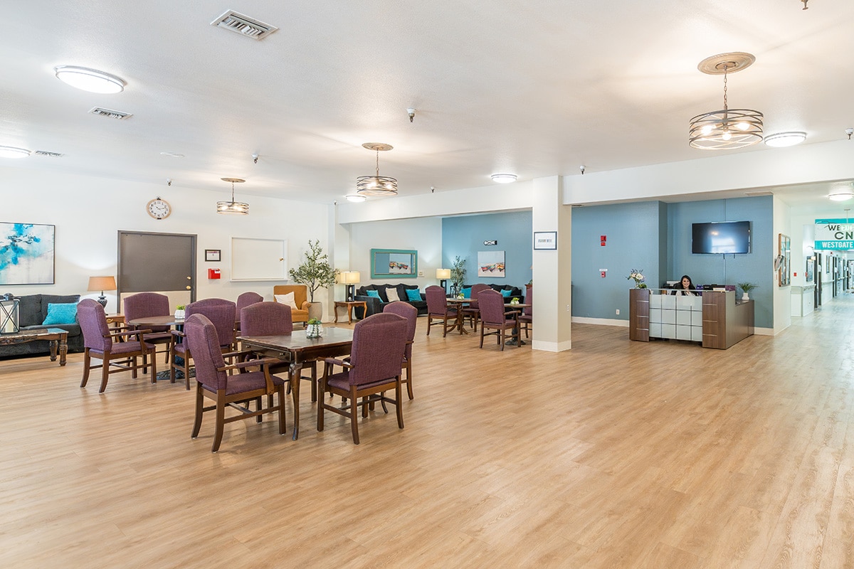 An open room to hang out in with tables and chairs